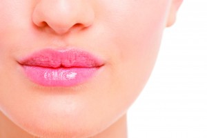 Closeup of pink lips of a beautiful woman